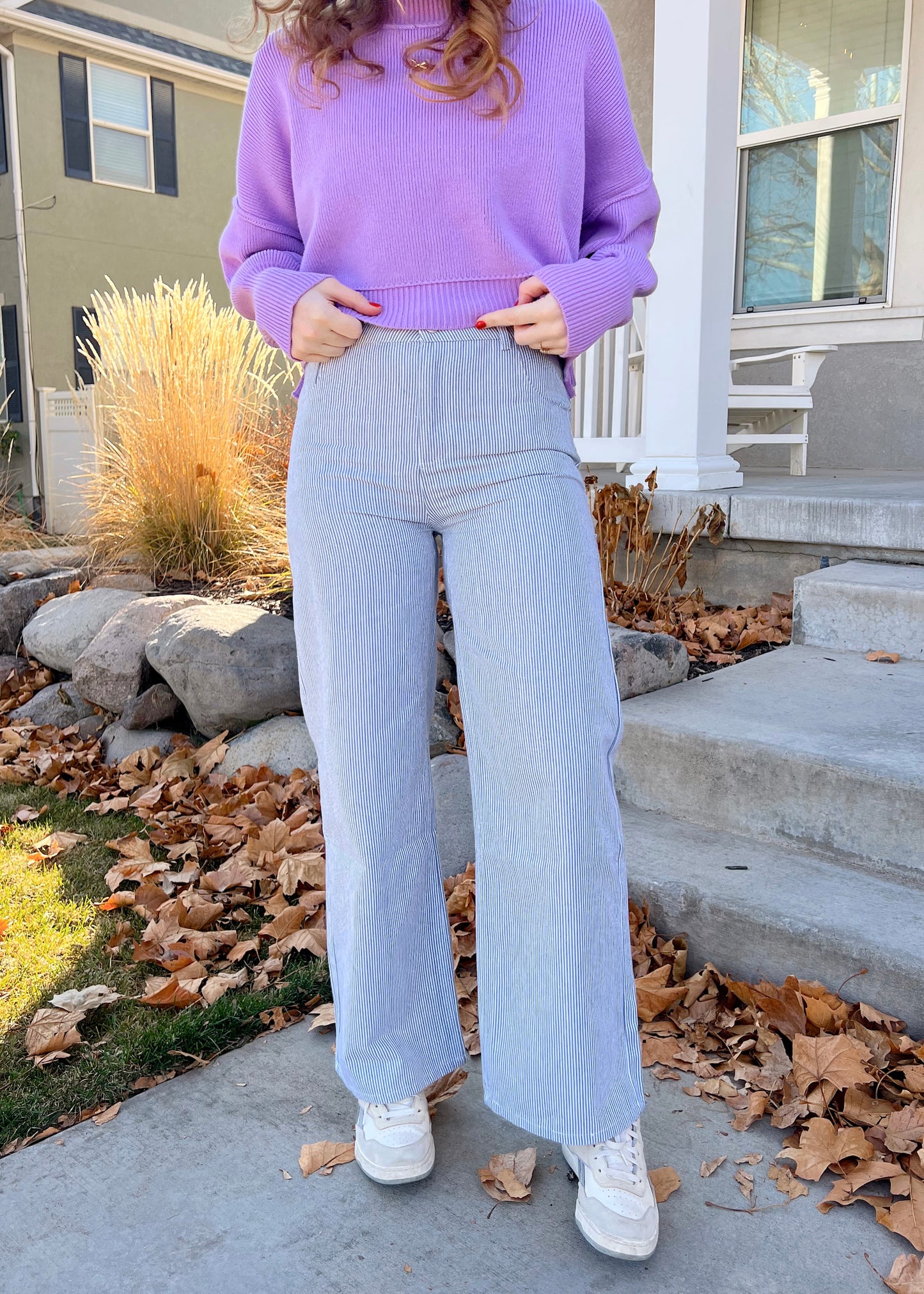 sitting on a bench in coney island pants