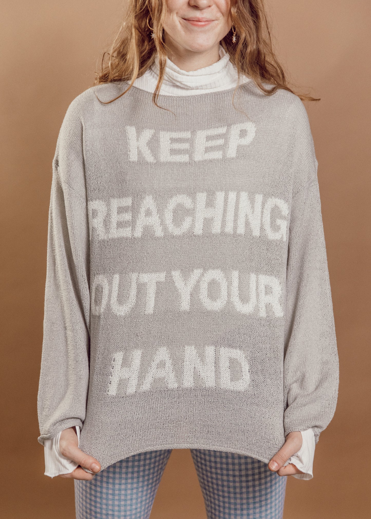 keep reaching out your hand sweater