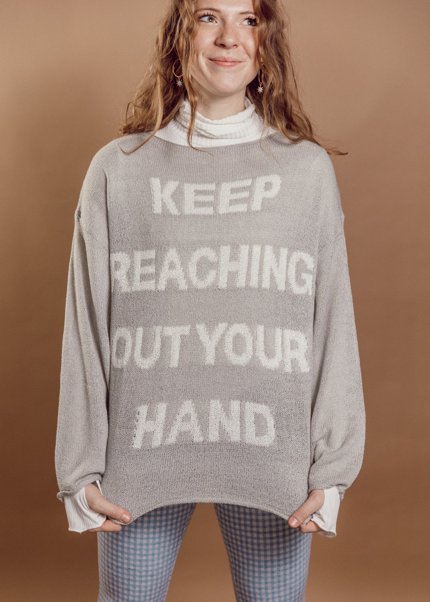 keep reaching out your hand sweater